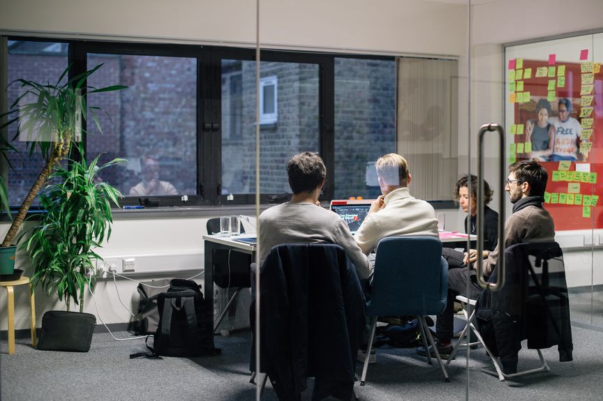 Photo of Common Knowledge team running a workshop in a typical workplace environment